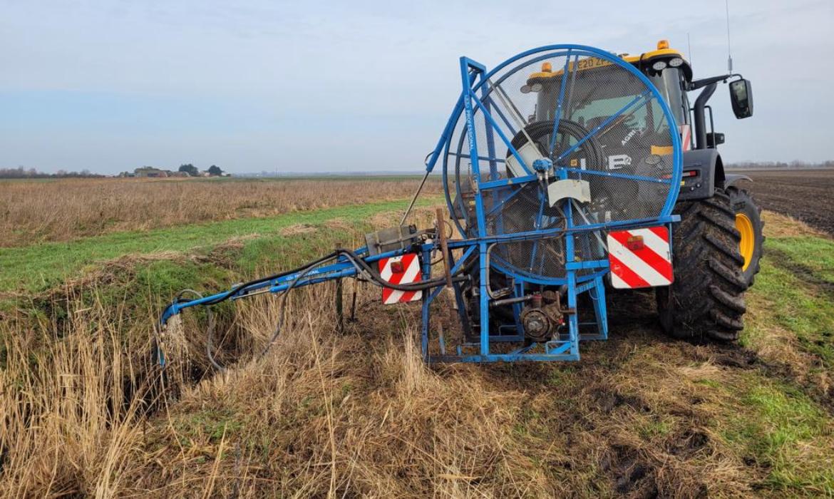 Tractor Drain Jetting along water side.